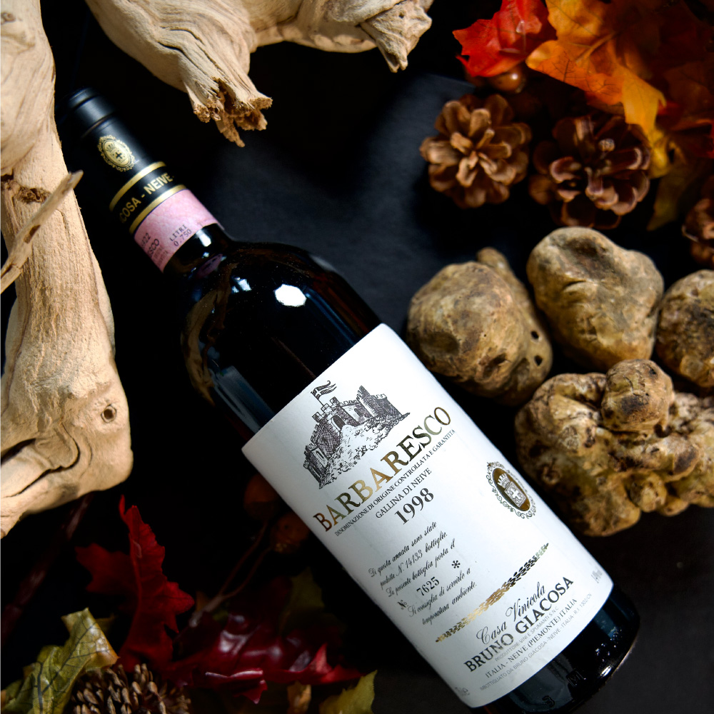 Bottle of Fine Wine 1998 Barolo Barbaresco Gallina Di Neive Casa Vinicola Bruno Giacosa 750ml. Truffles, pinecones, and driftwood background.
